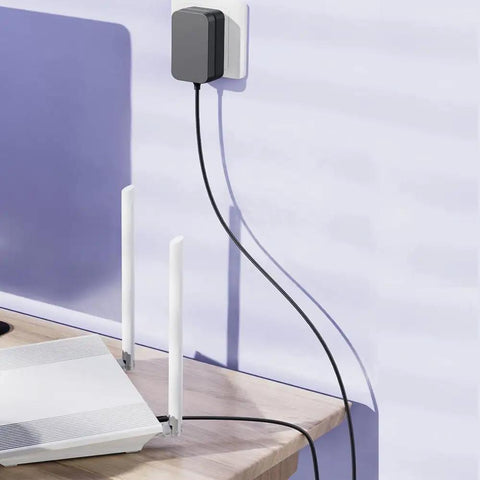 12V 2A Power Supply Adapter 120V AC To DC 12V 5.5x2.1mm Barrel Plug 24W Transformer plugged into wall socket