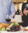 Premium Heat Shrink Wine Bottle Caps 100 Pack Flexible PVC Sealing Film on wine bottle with glasses and food.