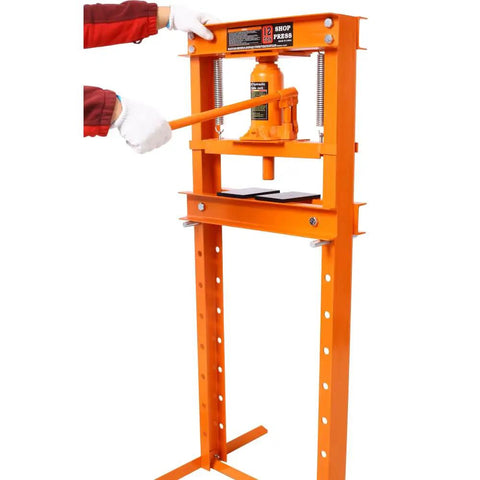 Heavy Duty 12 Ton Hydraulic Shop Press With Portable H Frame, bright orange, in use for bearing installation.