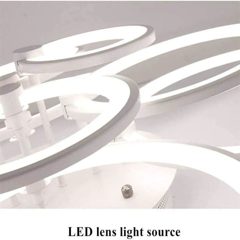 Close-up of dimmable modern ring ceiling light with six acrylic rings flush mount LED chandelier for bedroom living room kitchen.