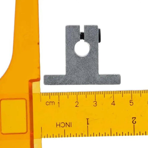 Four Pack Aluminum Linear Rail Shaft Supports For 8mm Diameter Shafts shown with orange measuring tool for scale.