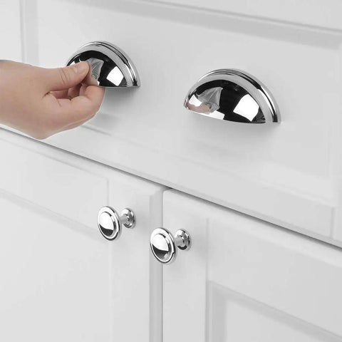 Hand using Chrome Bin Cup Drawer Pulls 3 Inch Center Spacing 76mm Cabinet Handles 25 Pack For Kitchen Cupboards Bedroom Dressers Bathroom Furniture Doors