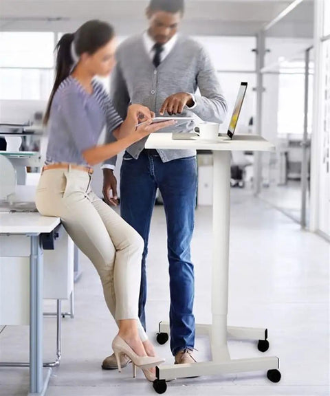 Pro Grade Aluminum Alloy Mobile Standing Desk Offering Hella Smooth Stepless Height Adjustment And Ridiculously Stable Wheeled Base For Your Next Level Workstation Flex in office setting.