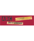 Top Tier 41 Piece Router Template Set With Self Spacing 2.5 Inch Alphabet Characters used to create wooden signs: ABC, Sweet Corn, Joe's Workshop.