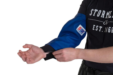 Heavy Duty Waterproof Fishing Arm Sleeves With Hella Comfy Neoprene Cuffs, blue sleeve being put on a forearm