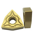 WNMG432 solid carbide triangular turning insert, bronze color with center hole; two-piece set with holder block.
