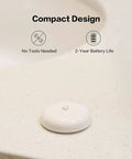 Water Leak Sensor For Smart Home, Zigbee Wireless Leak Detector With App Alerts on a countertop