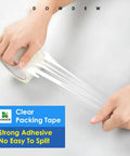Hands using Ultra Strong Clear Packing Tape 1.88 Inch by 55 Yards Heavy Duty Shipping Tape Refill 2 Pack on box