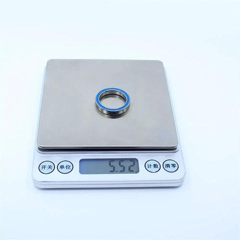 Blue Sealed 6704RS ball bearing on a scale, part of RC vehicle wheel and axle bearings, 20x27x4 mm ABEC 3 2RS, 10 pieces set.