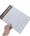 Hand holding Self-Seal White Poly Mailer Bags 100 Pack 10x14 Inches Waterproof And Tear-Resistant Shipping Bags For Clothes.