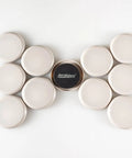 Round Two And Half Inch Reusable Furniture Sliders For Carpet Eight Pack Beige arranged in a row on a white background