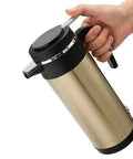 Boss 12V Car Truck Electric Heating Kettle Vacuum Stainless Steel Coffee Pot Water Heater Flask with lid, held in hand.