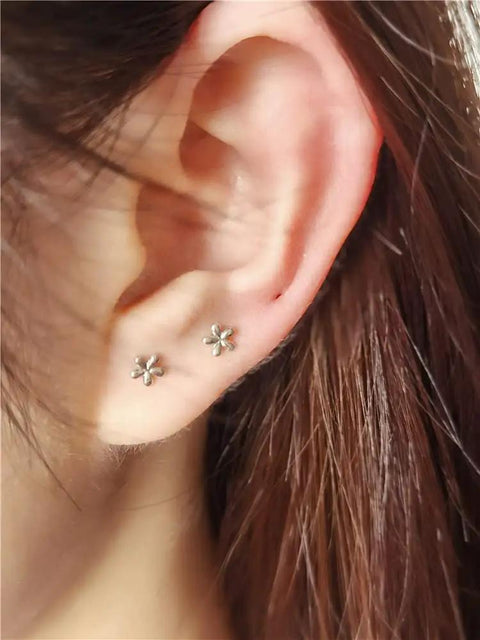 18G Tiny Flower Cartilage Earrings For Women And Girls In 925 Sterling Silver Daisy Studs With 3mm Ball Screw Back Sleeper Tragus Post Hypoallergenic Piercing Body Jewelry on ear
