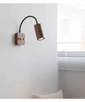 Modern Walnut Wall Sconce With 360 Degree Swivel Spotlight brings chill vibes to bedrooms with a stylish solid wood finish.