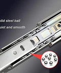 Close-up view of heavy duty push to open drawer slides with full extension, showcasing solid steel ball bearings for smooth operation.