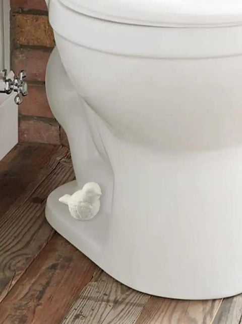 Slick White Ceramic Bird Toilet Bolt Covers Hiding Exposed Flange Nuts Zero Stress Install on toilet base with wood floor