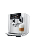 Top Shelf Automatic Espresso Coffee Maker With Dual Bean Hopper And Sweet Foam Milk Frother One Touch Brew White with latte in glass.