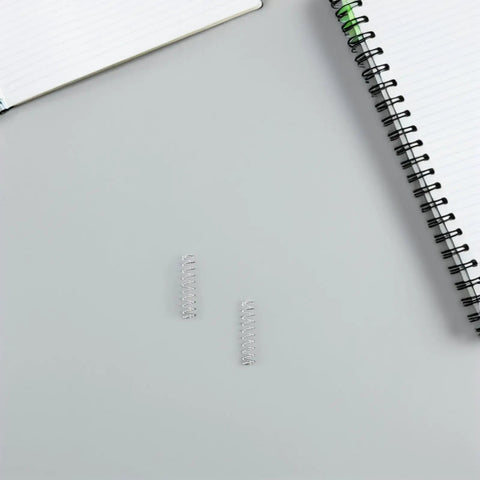 Upgrade Your Pens With A 40pc Ballpoint Pen Spring Kit Made From Durable Stainless Steel For Smooth Writing, quick refill springs on notebook page