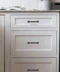 Rustic Black Cabinet Pulls 10 Pack Antique Hammered Kitchen Hardware Vintage Drawer Handles installed on white kitchen cabinets.