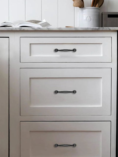 Rustic Black Cabinet Pulls 10 Pack Antique Hammered Kitchen Hardware Vintage Drawer Handles installed on white kitchen cabinets.