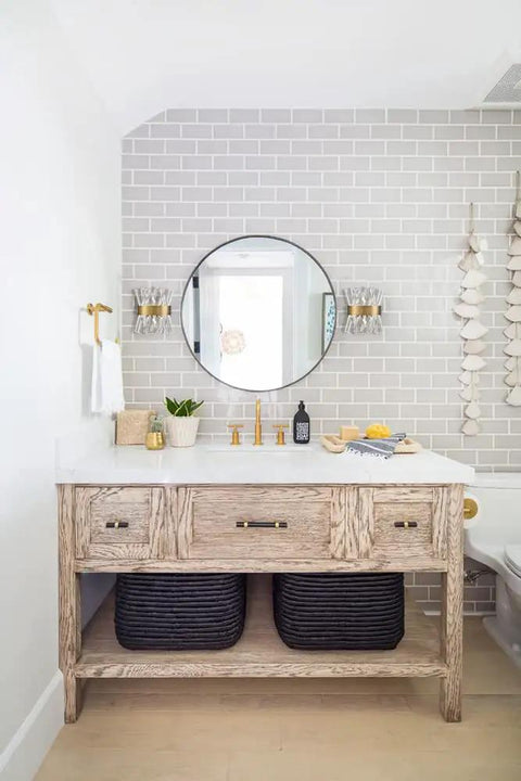 Bathroom with brick wall, round mirror, and Mid Century Modern Gold Crystal Wall Sconce Set Of Two With Glass Rods Brass Finish