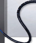 Flexible Spiral Cable Management Sleeve For Office And Home Use Durable PE Wire Organizer No Tools Needed Easy Wrap Flame Retardant And Wear Resistant Protect Cables From Damage Available In 10mm And 16mm Options 7m And 4m Lengths in use on desk for cable protection