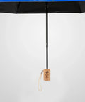 Top Shelf Wooden Replacement Umbrella Handle For Folding Parasols And Sun Canopies With Heavy Duty 13 To 14 Millimeter Shaft Grip visible with black umbrella.