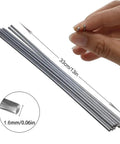 Hand holding Low Temp Flux-Cored Aluminum Brazing Rods Set, 100 Pcs For Welding Aluminum, showing 33cm length and 1.6mm diameter
