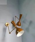 1950 Mid Century Italian Hardwire Brass Wall Sconce Pair Brown Wall Fixture Diabolo Lamp on wall with unique brown shades.
