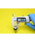 Measuring 9.00mm thickness of JANURSDHA 6200 Hybrid Ceramic Bearing Set 10x30x9mm with digital caliper.
