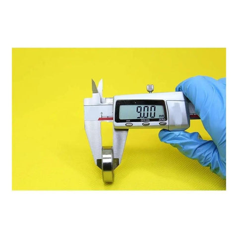 Measuring 9.00mm size of Smooth Hybrid Ceramic Ball Bearings For Motor Spindles And Industrial Gearboxes using a caliper.