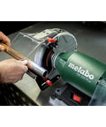 Heavy Duty 8 Inch Bench Grinder With 3600 Rpm And 5.5 Amp Motor featuring a worker sharpening a metal rod.