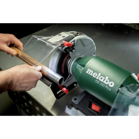 Heavy Duty 8 Inch Bench Grinder With 3600 Rpm And 5.5 Amp Motor featuring a worker sharpening a metal rod.