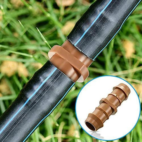 Brown 1/2-inch barbed irrigation fitting on black drip tubing; close-up view