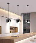 ZSJPDP American Industrial Style Metal Hanging Lamp, 8.2in, three black pendant lights above a modern kitchen bar.
