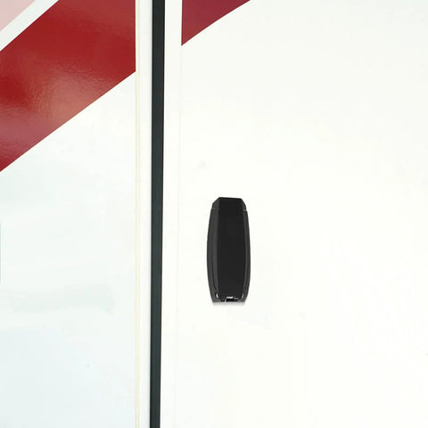 Sturdy Black Truck Rv Baggage Door Catches Clips with High Hardness Holders Retainers For Camper And Trailer Heavy Duty Plastic Clasp Hangers mounted on a white storage door.
