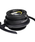 Easy Plug And Play Quick Release Steering Wheel Kit With Gen 4.0 Adapter Black Body And Ring With Handles 6x70mm And 6x74mm Bolt Patterns Horn Wiring Ready Secure Install For Cars And Trucks. Close-up of black adapter with handles and wiring.