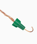 Green Ground Wire Connector Nuts With Holes Pack Of 20 for 14 to 10 AWG snapping onto copper wire, close-up angle.
