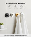 Four modern suction cup hooks with towels, minimalist design, different colors; heavy duty suction cup hooks for shower stainless steel no drill mounts with strong vacuum grip waterproof for glass doors tile and mirror damage free installation by pressing and twisting to lock great for towels wreaths and more.