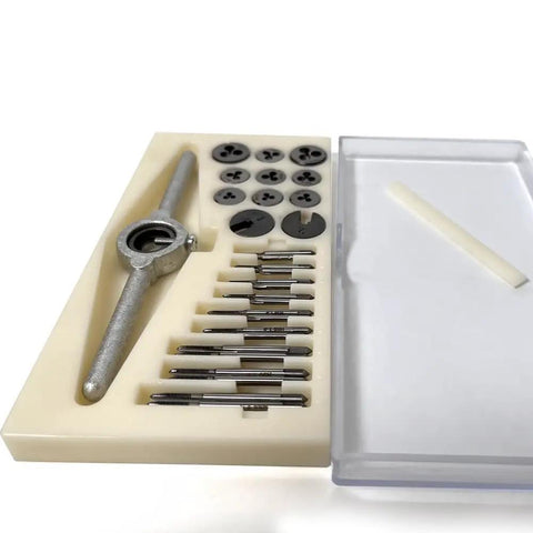 Close-up of 31 Piece Micro Metric Tap And Die Set for M1 to M2.5 threads, including tools and case, rust-resistant coating visible.