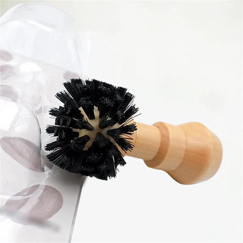 Espresso Portafilter Cleaning Brush with wood handle and stiff nylon bristles scrubbing coffee basket fitting 58mm espresso machines.