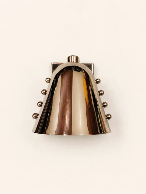 Modern Adjustable Chrome Wall Sconce Polished Metal E26 modern wall lamp with polished brass finish and decorative vertical rods.