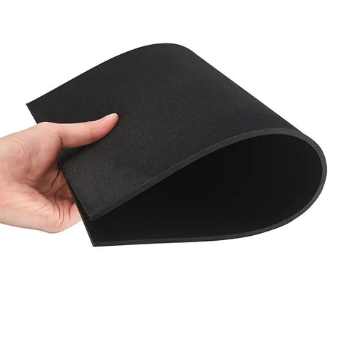 Durable Rubber Soling Sheet For Shoe Repair And DIY Kicks, 5/32 Inch Thick Black Sole Material held to show flexibility