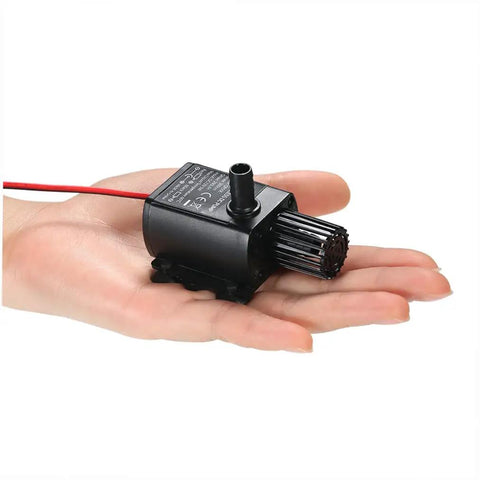 Mini Submersible Aquarium Pump DC 12V 5W Quiet Water Circulation For Pond And Fish Tank 280 Liters Per Hour in hand for size comparison