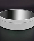 KobeIeen Electric Jewelry Turntable Display With 3 Speed Settings, sleek round shape, sturdy white ABS material, reflective mirror finish.