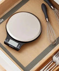 Digital Kitchen Scale With Large LCD Display And Tare Function, pro-grade, sleek black and stainless steel, in kitchen drawer
