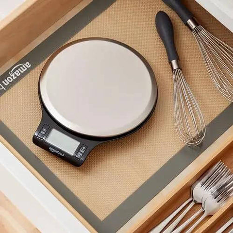Digital Kitchen Scale With Large LCD Display And Tare Function, pro-grade, sleek black and stainless steel, in kitchen drawer