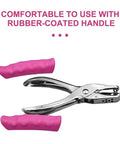 No Fuss Easy Grip One Quarter Inch Hole Punch With Scraps Tray, pink rubber-coated handles for crafts and binders use.