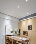 SDdPulse 4 Pack Recessed Lighting Recessed Light Fixtures,5W,7W,10W,12W,15W,20WLED Can Lights Aluminum Baffle Trim Downlight Spotlight,5w-White Light illuminating a modern dining area.