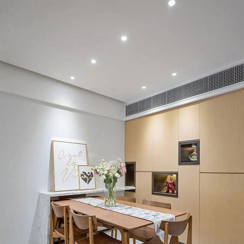 SDdPulse 4 Pack Recessed Lighting Recessed Light Fixtures,5W,7W,10W,12W,15W,20WLED Can Lights Aluminum Baffle Trim Downlight Spotlight,5w-White Light illuminating a modern dining area.